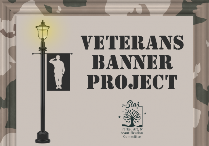 Picture of a street light with a banner with a soldier giving a salute