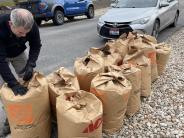 People raking leaves