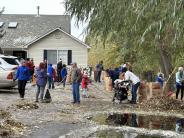 People raking leaves