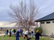 People raking leaves