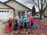 People raking leaves