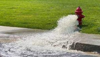 fire hydrant with water gushing out of it