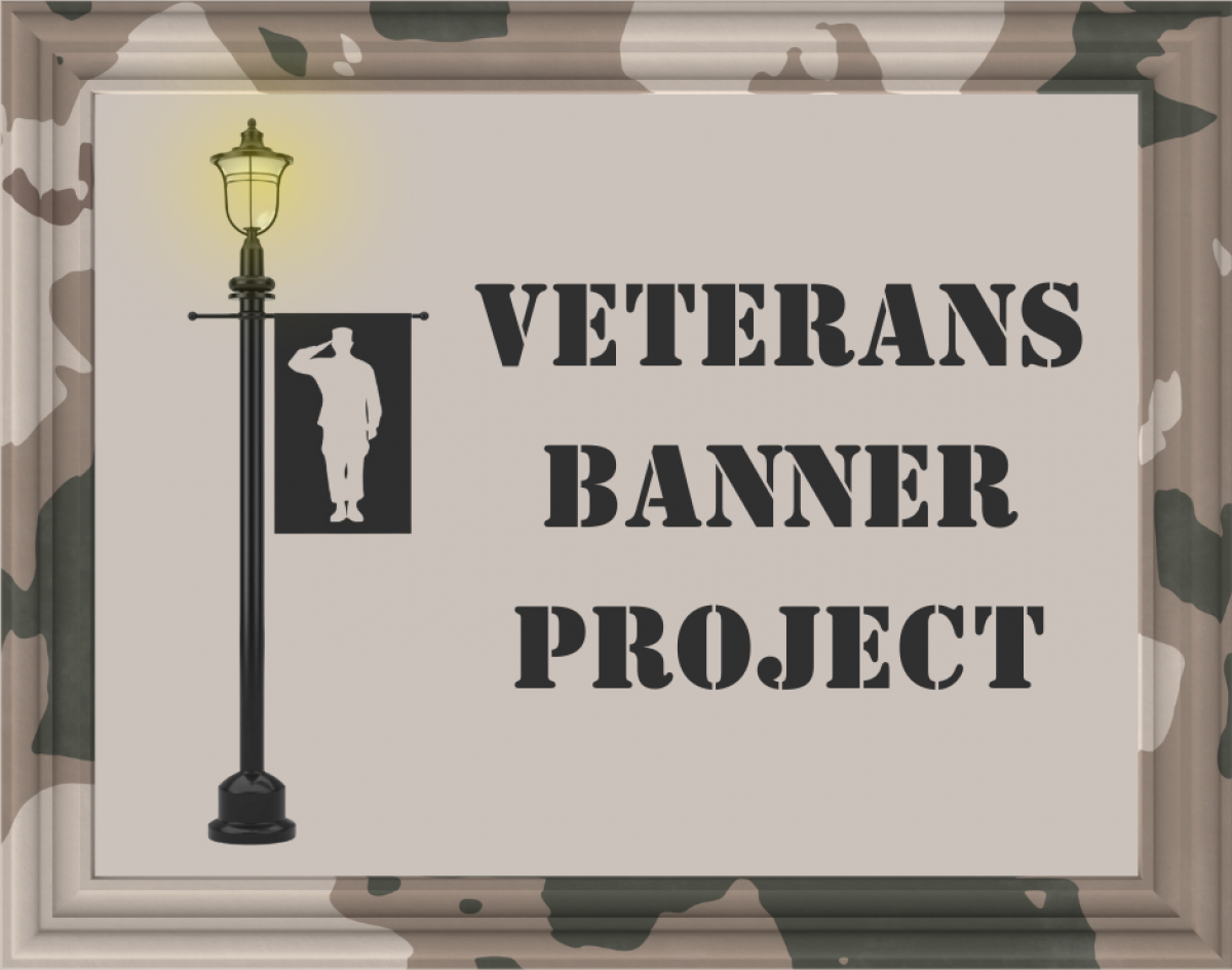 soldier on banner saluting, banner is on a lit lightpole